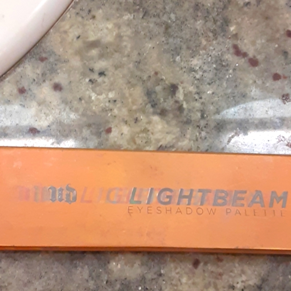Urban Decay Lightbeam eyeshadow palette. Hardly used.